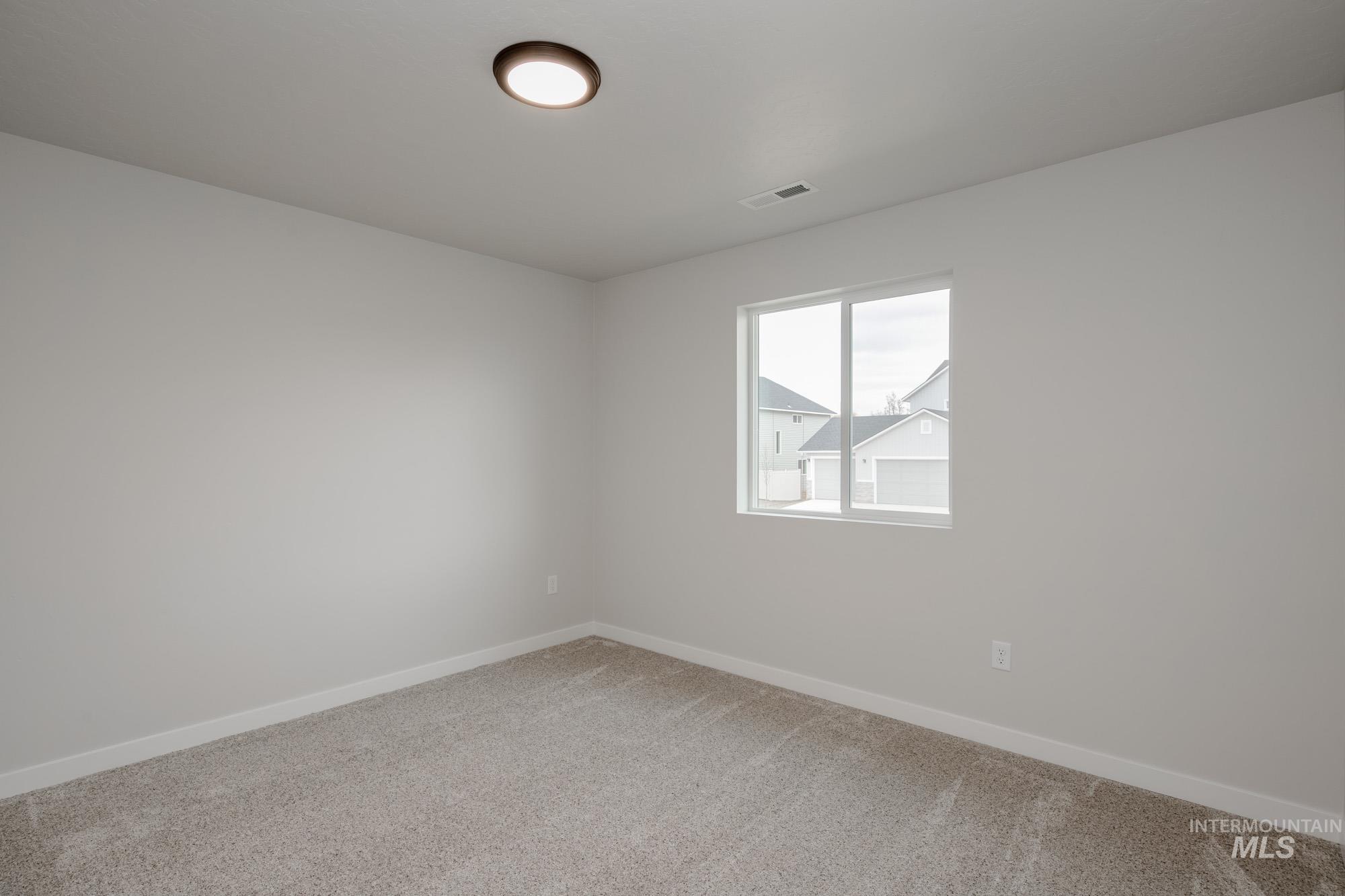 3090 South Maple Rnch Way Nampa, ID 83686 - Photo 15 of 22 Spare room with carpet and baseboards