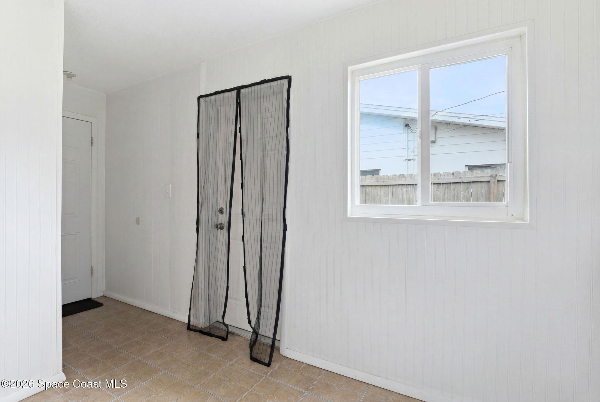 908 Jefferson Road Rockledge, FL 32955 - Photo 22 of 37 an empty room with a window