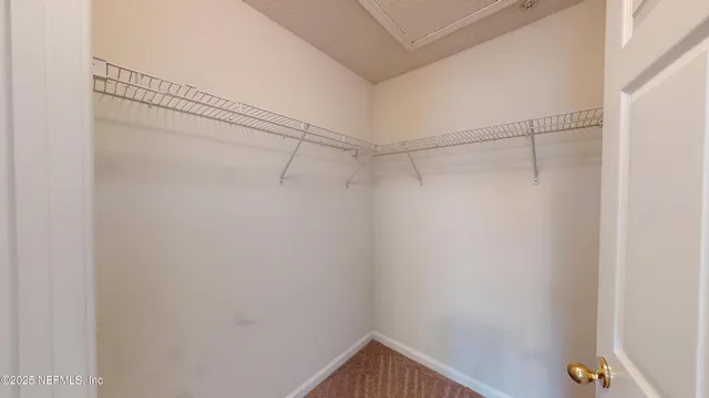 a view of a room with racks on the wall