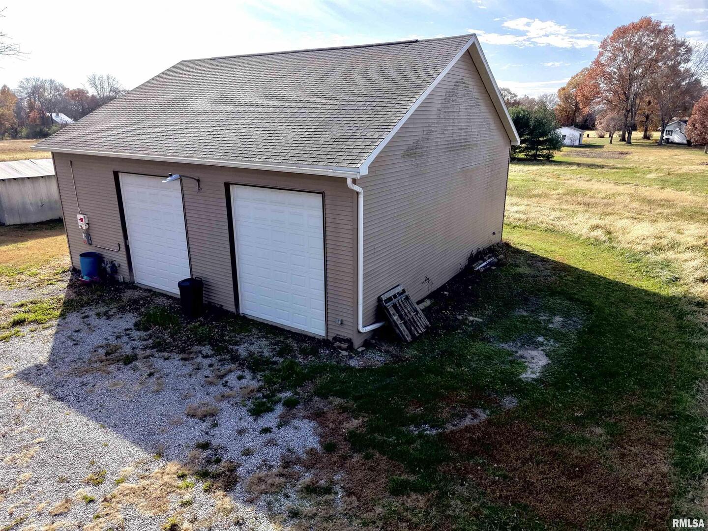 103 Watkins Street Cisne, IL 62823 - Photo 35 of 85 a view of a backyard with plants and large tree