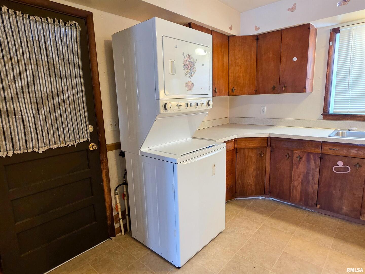 103 Watkins Street Cisne, IL 62823 - Photo 41 of 85 a kitchen with a sink and cabinets