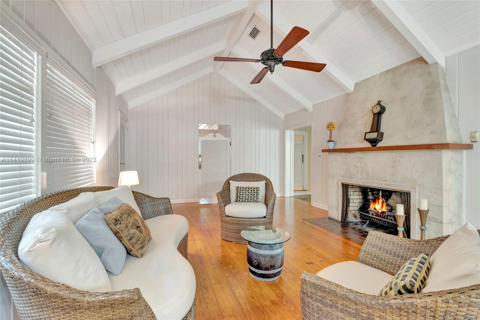 2801 Emathla Street Miami, FL 33133 - Photo 11 of 16 a living room with furniture and a fireplace