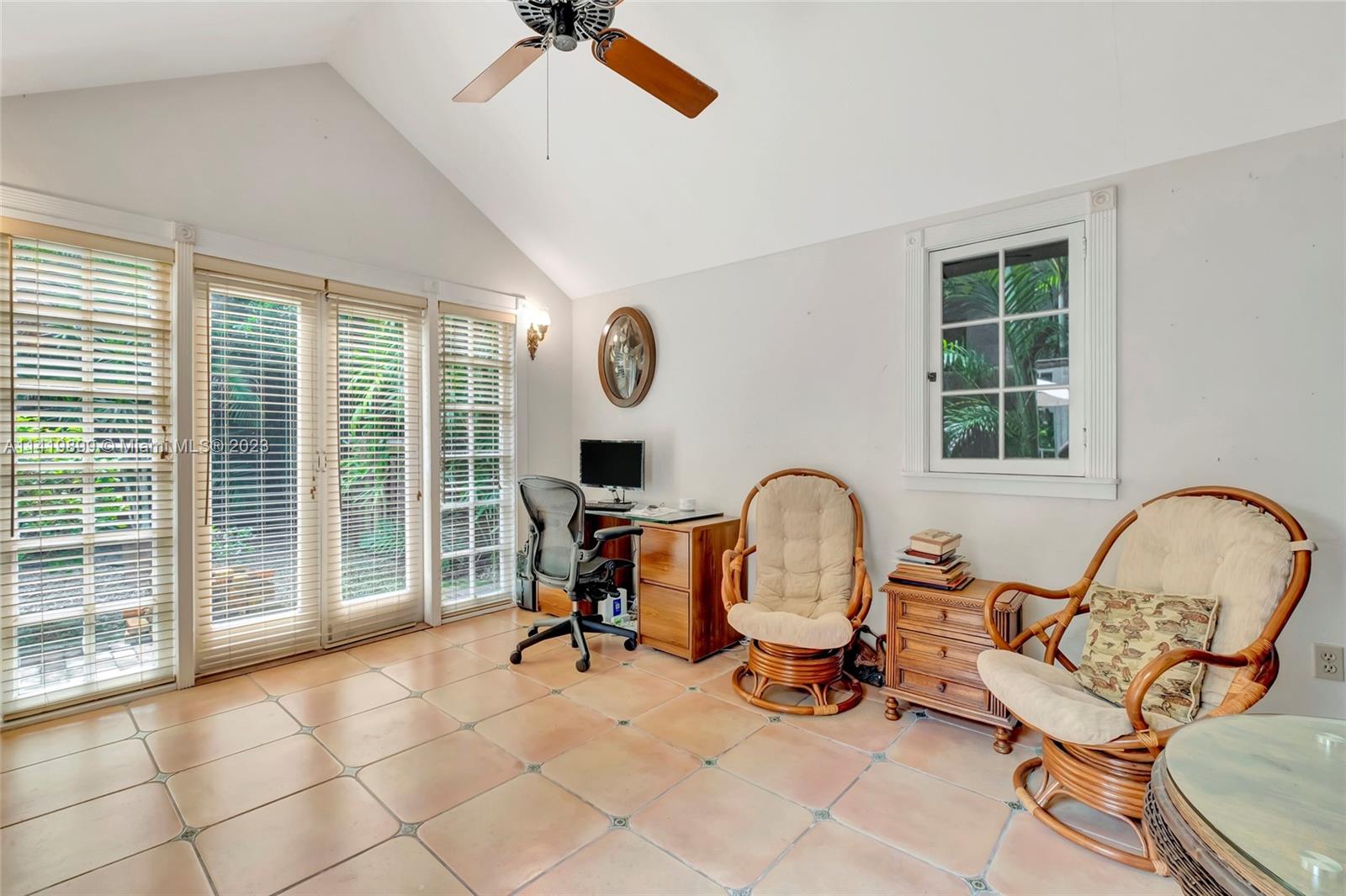 2801 Emathla Street Miami, FL 33133 - Photo 12 of 16 a view of a workspace with furniture and a window