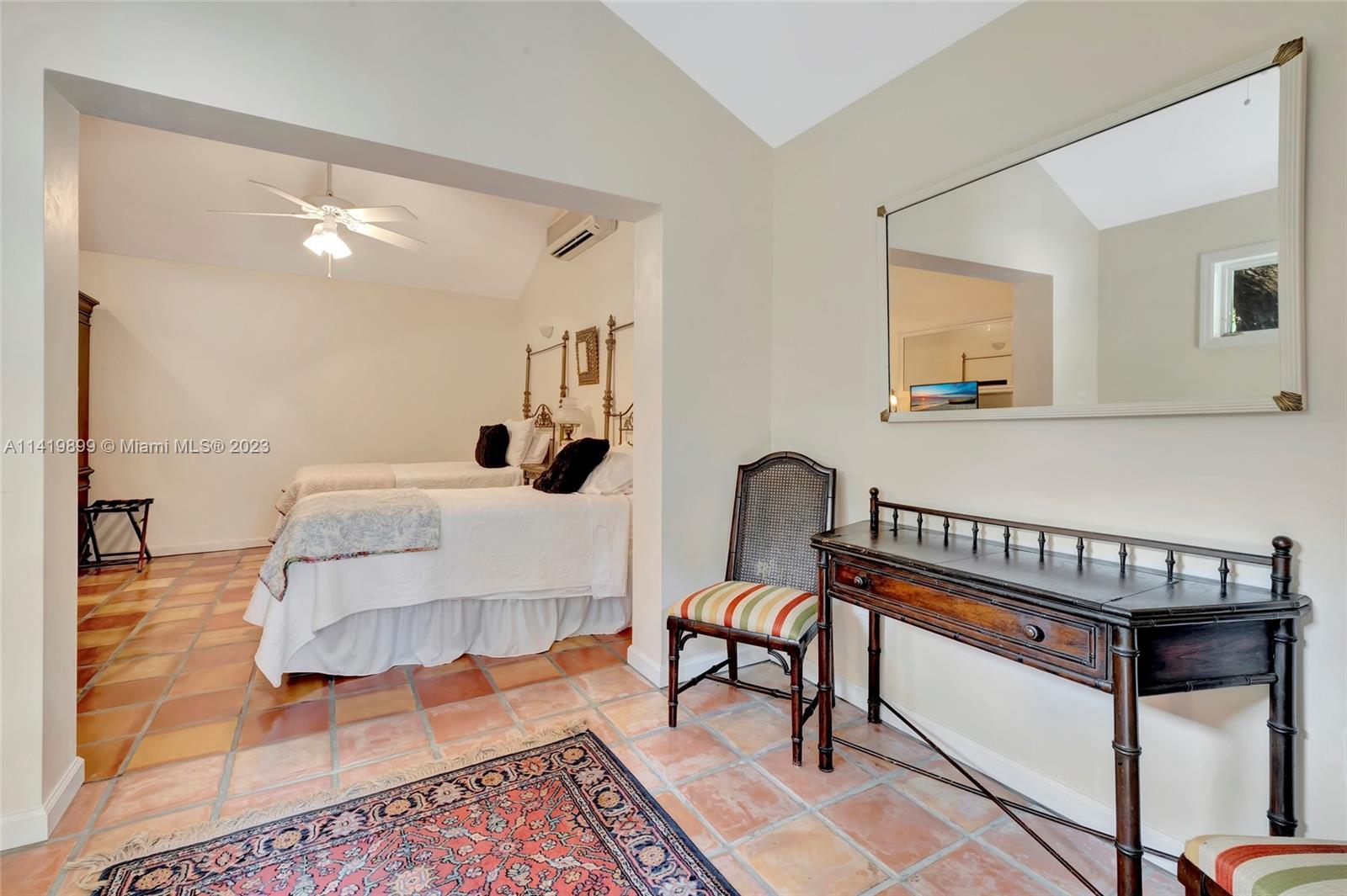 2801 Emathla Street Miami, FL 33133 - Photo 13 of 16 a bedroom with furniture and a wooden floor