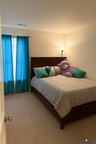 a bedroom with a bed and a cabinets