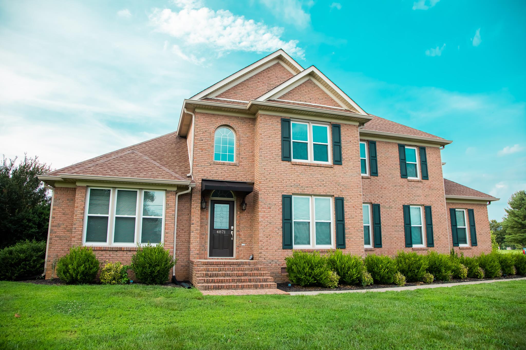 4871 Sango Road Clarksville, TN 37043 - Photo 1 of 30 a front view of a house with a yard