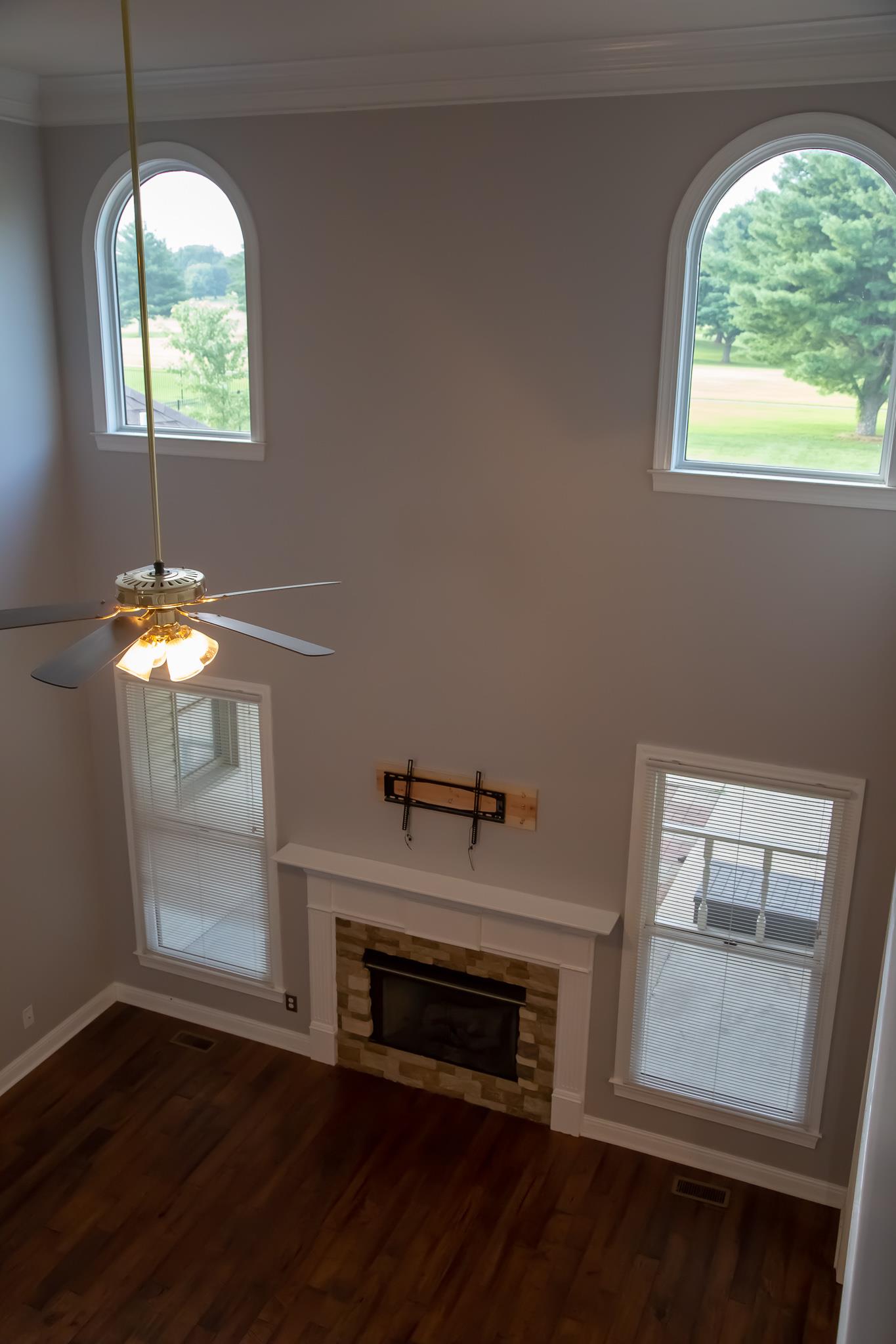 4871 Sango Road Clarksville, TN 37043 - Photo 11 of 30 wooden floor in an empty room with a window