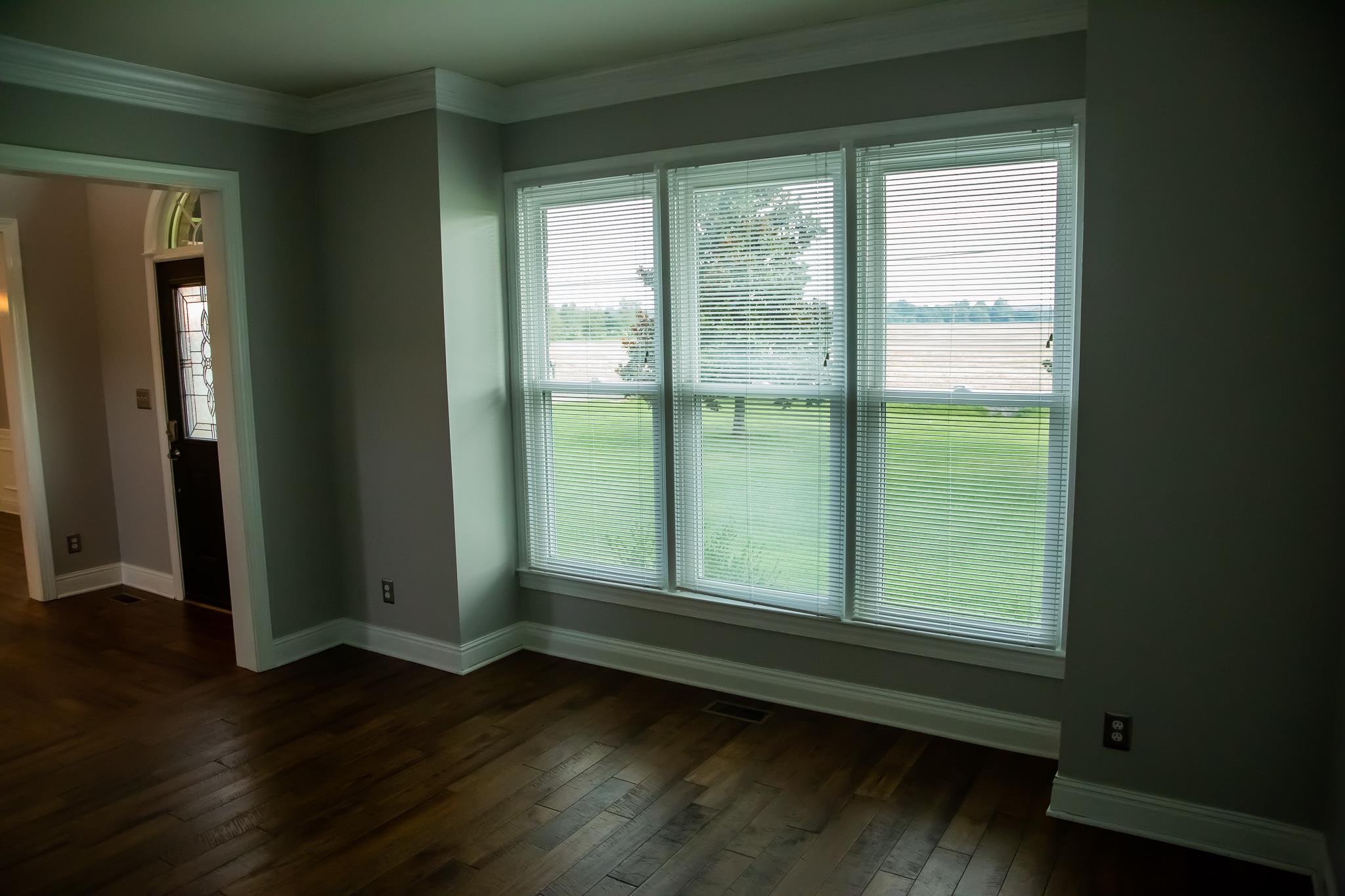 4871 Sango Road Clarksville, TN 37043 - Photo 13 of 30 a view of empty room with wooden floor and fan
