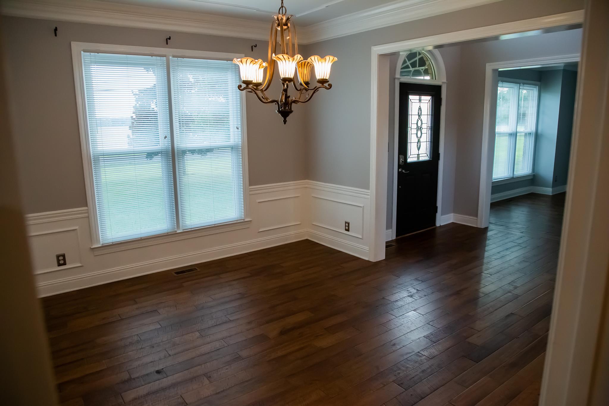4871 Sango Road Clarksville, TN 37043 - Photo 14 of 30 wooden floor in an empty room with a window