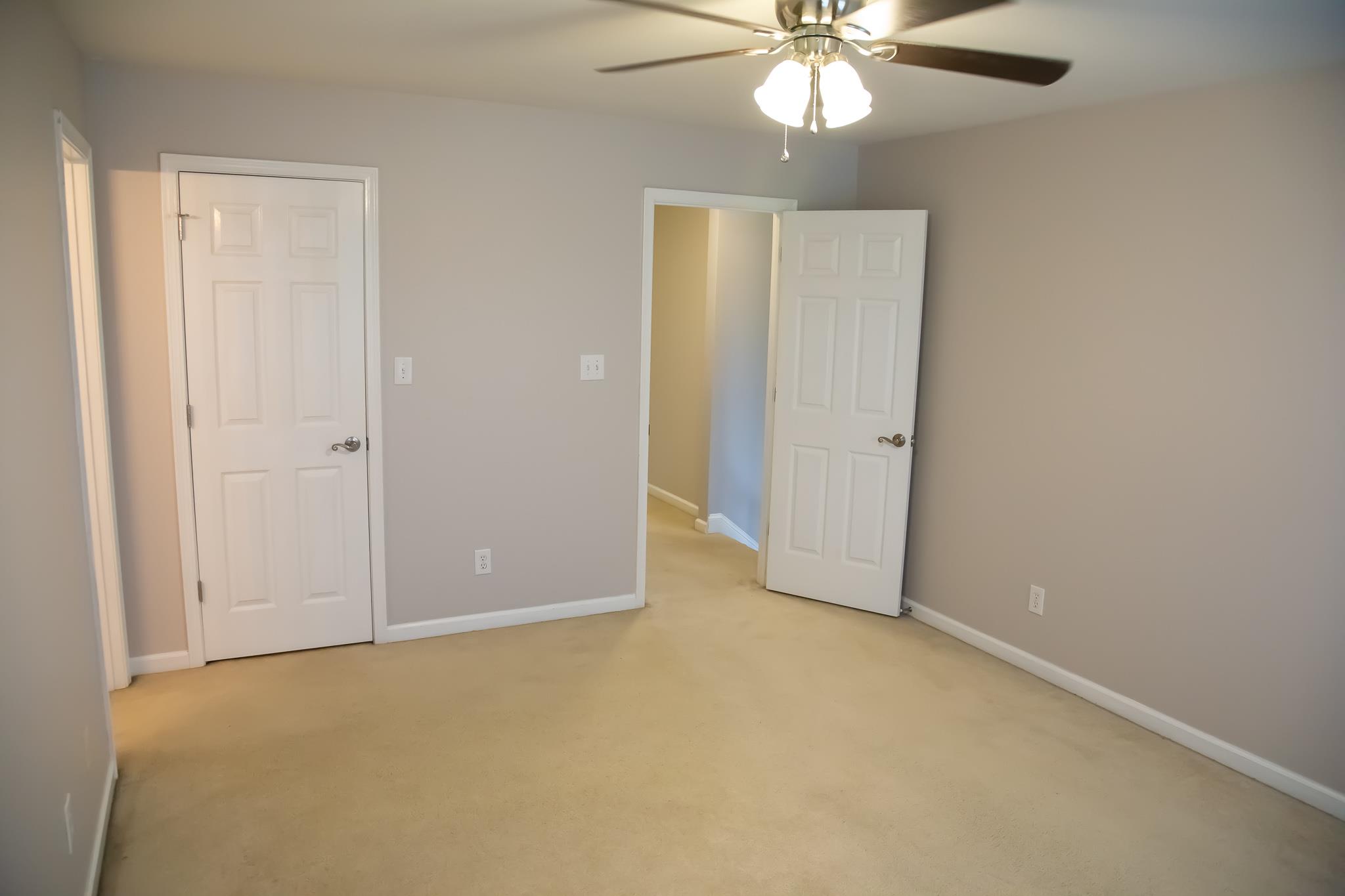 4871 Sango Road Clarksville, TN 37043 - Photo 20 of 30 an empty room with closet and a chandelier fan