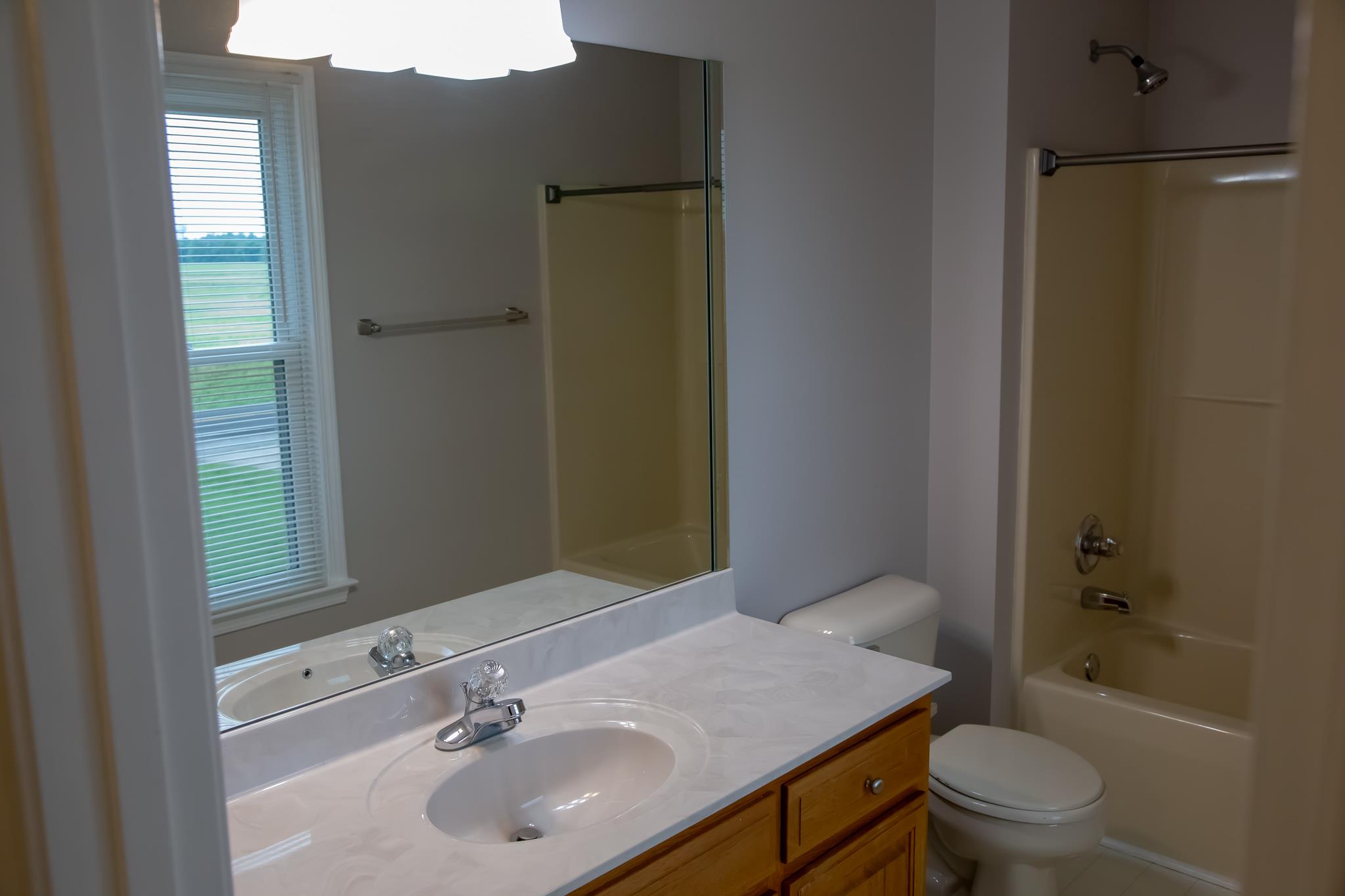 4871 Sango Road Clarksville, TN 37043 - Photo 26 of 30 a bathroom with a sink toilet and shower