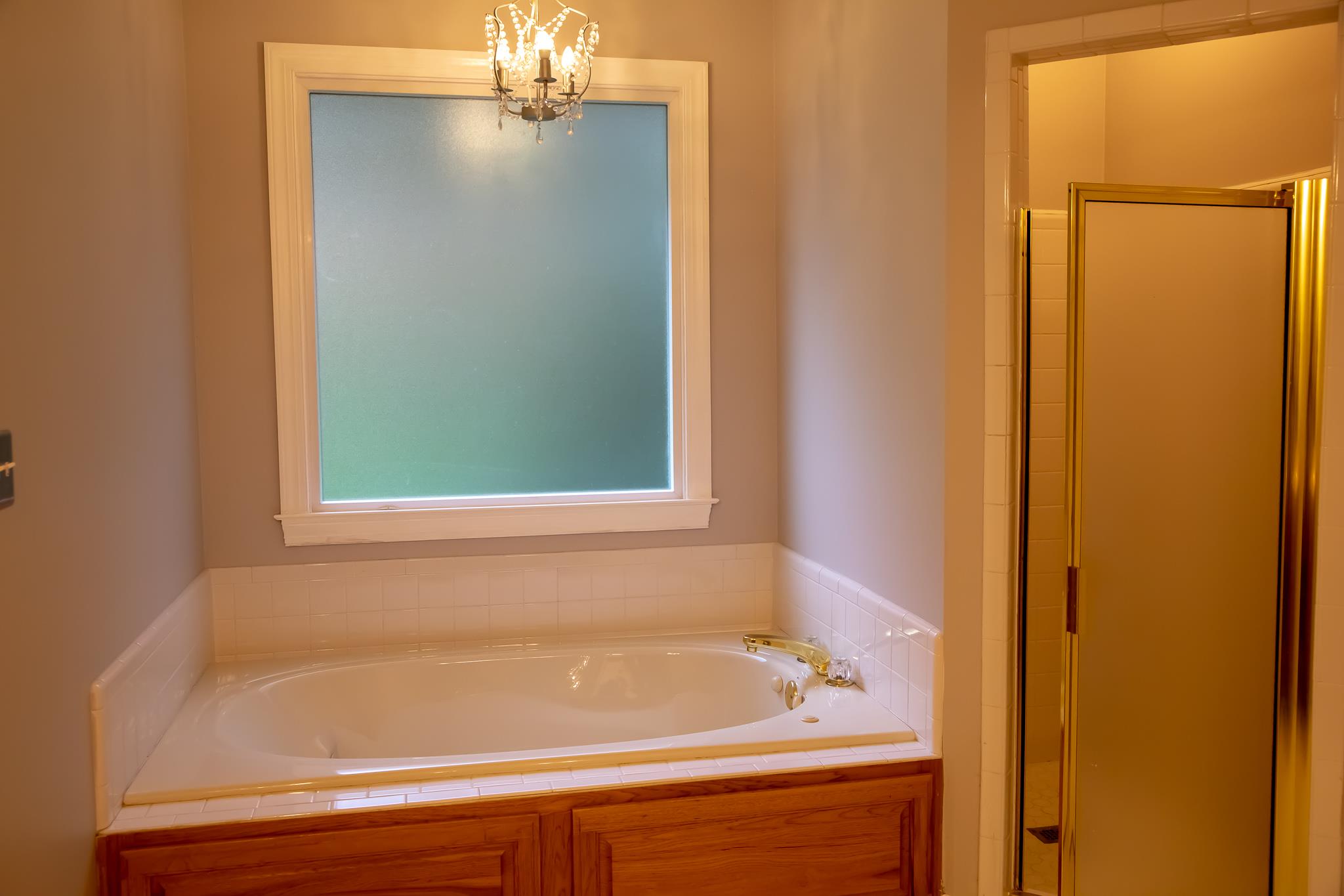 4871 Sango Road Clarksville, TN 37043 - Photo 30 of 30 a bathroom with a bathtub and a shower