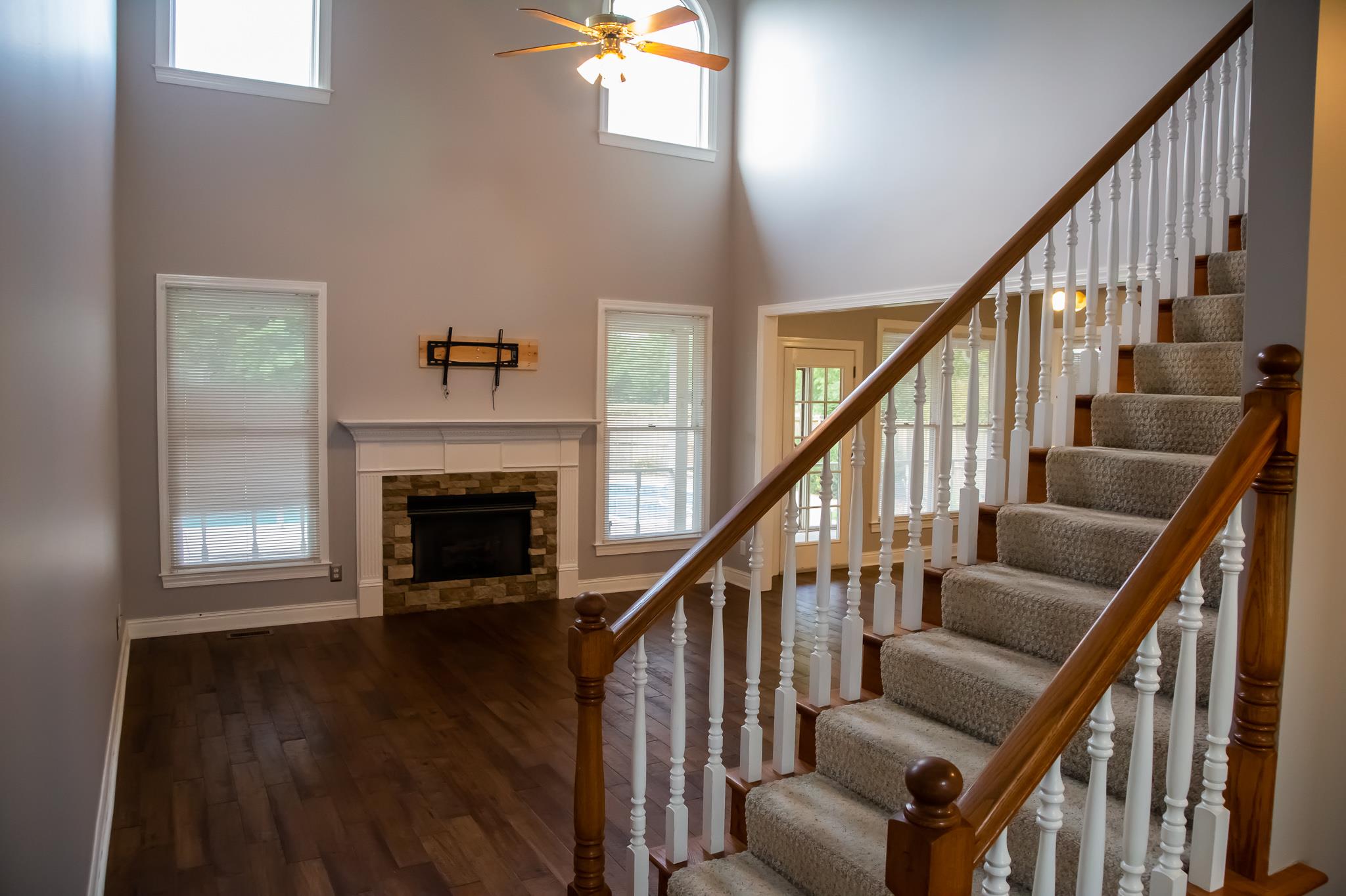 4871 Sango Road Clarksville, TN 37043 - Photo 9 of 30 a view of an entryway with wooden floor and staircase