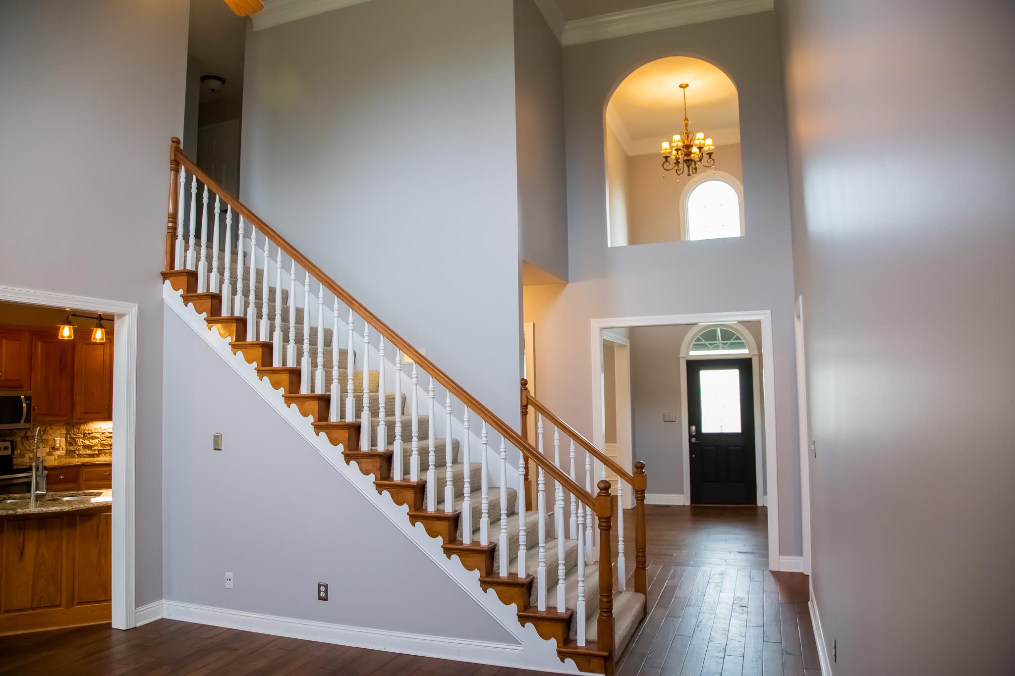 4871 Sango Road Clarksville, TN 37043 - Photo 10 of 30 a view of a livingroom with wooden floor and staircase