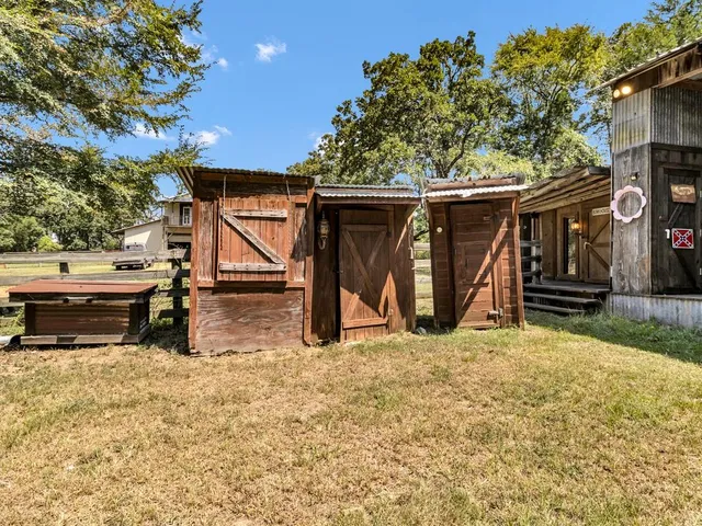 a view of outdoor space with wooden floor