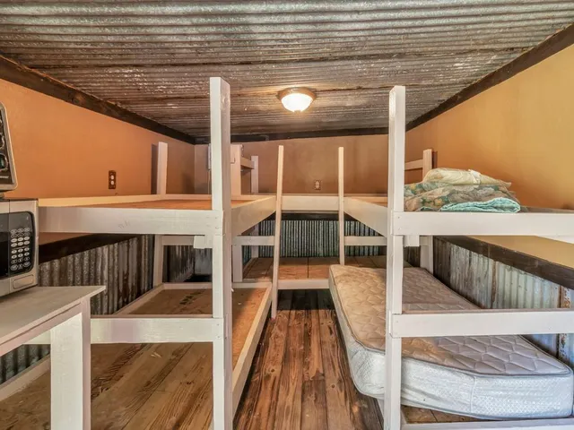 a view of balcony with wooden floor