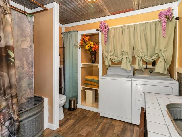 a view of a refrigerator and a stove top oven