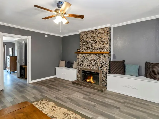 a living room with furniture and a fireplace