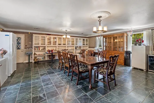 a view of a dining room with furniture window and outside view