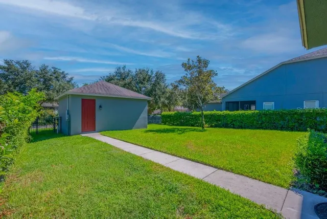 a view of a house with a yard