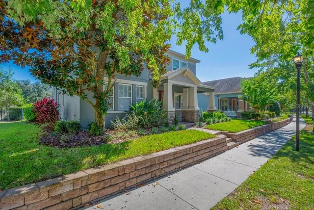 a front view of a house with a garden