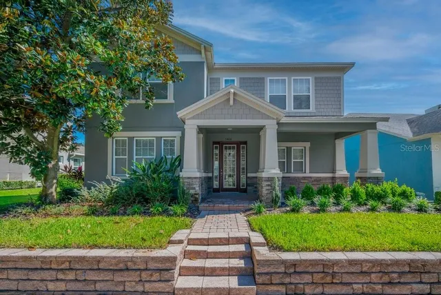 a front view of a house with garden