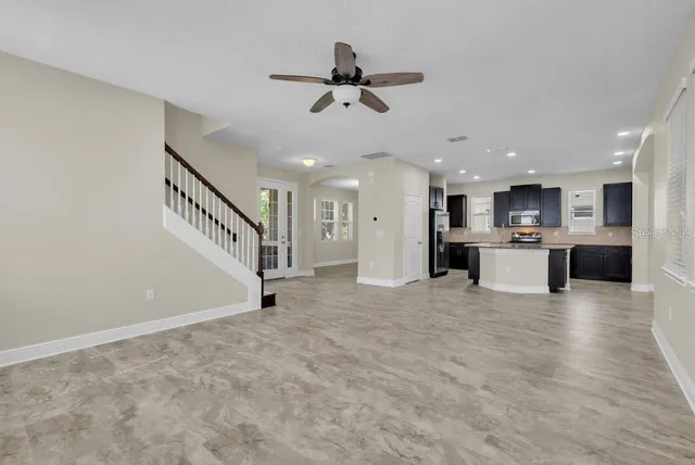 a view of a kitchen with a sink and a stove top oven