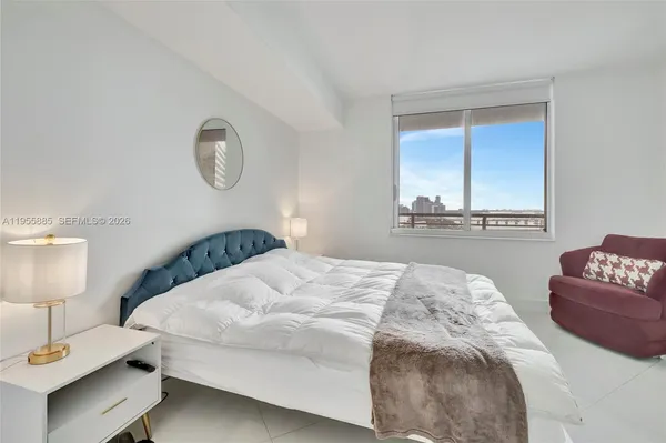 a bedroom with a bed and a couch