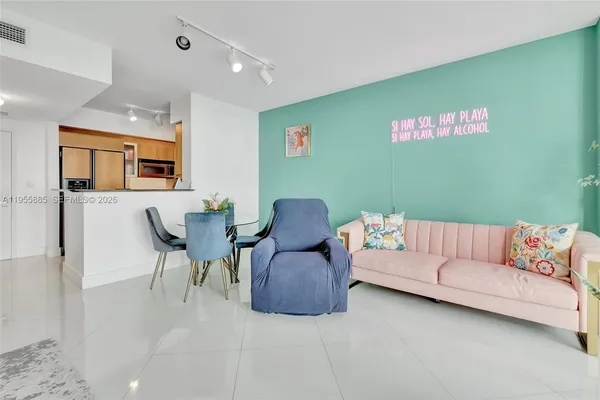 a living room with furniture and flowers