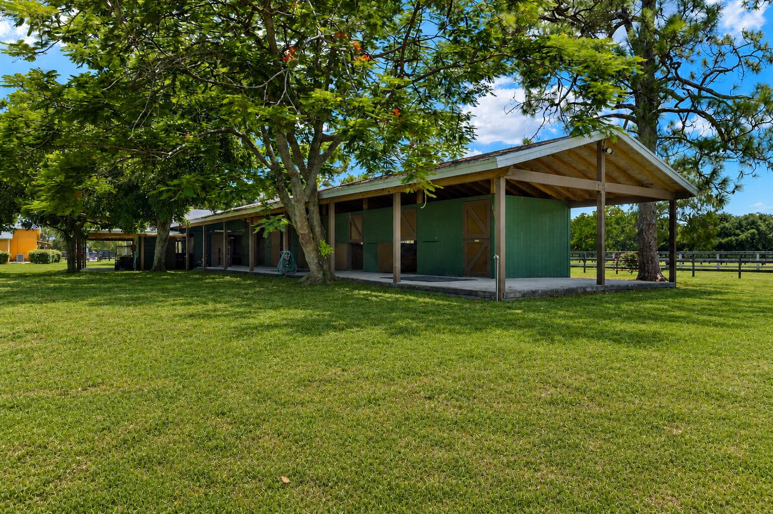 16031 Rustic Road Wellington, FL 33470 - Photo 5 of 11 a backyard of a house with lots of green space