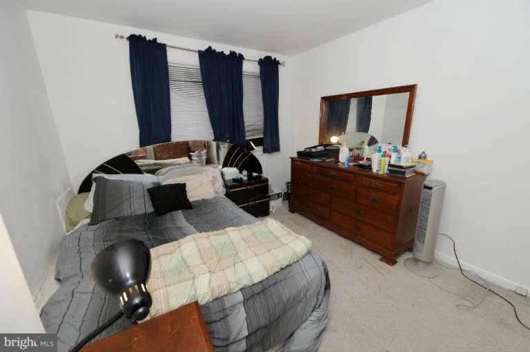 2237 Southorn Road Baltimore, MD 21220 - Photo 12 of 15 a bedroom with furniture and a mirror