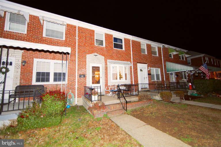 2237 Southorn Road Baltimore, MD 21220 - Photo 15 of 15 a patio with a table and chairs and potted plants