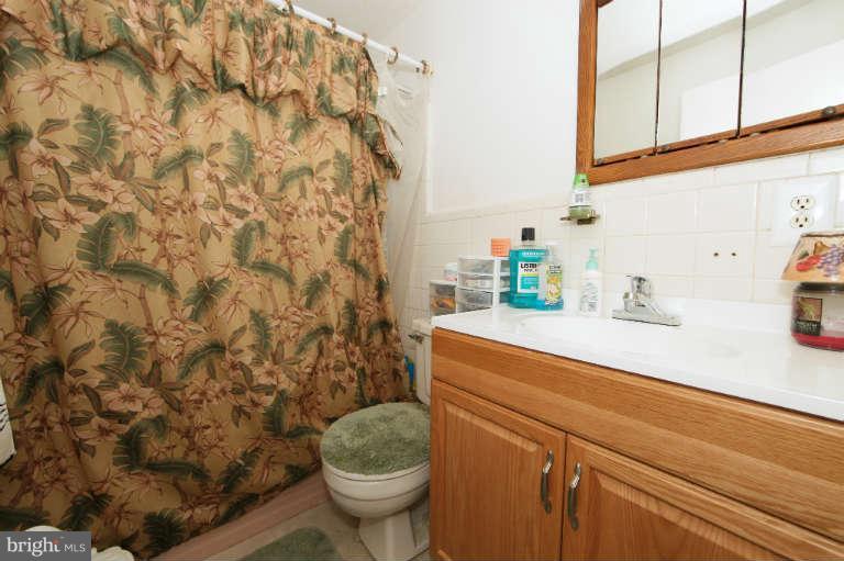 2237 Southorn Road Baltimore, MD 21220 - Photo 10 of 15 a bathroom with a sink toilet and shower