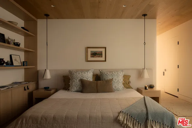 a bedroom with a bed and a cabinets