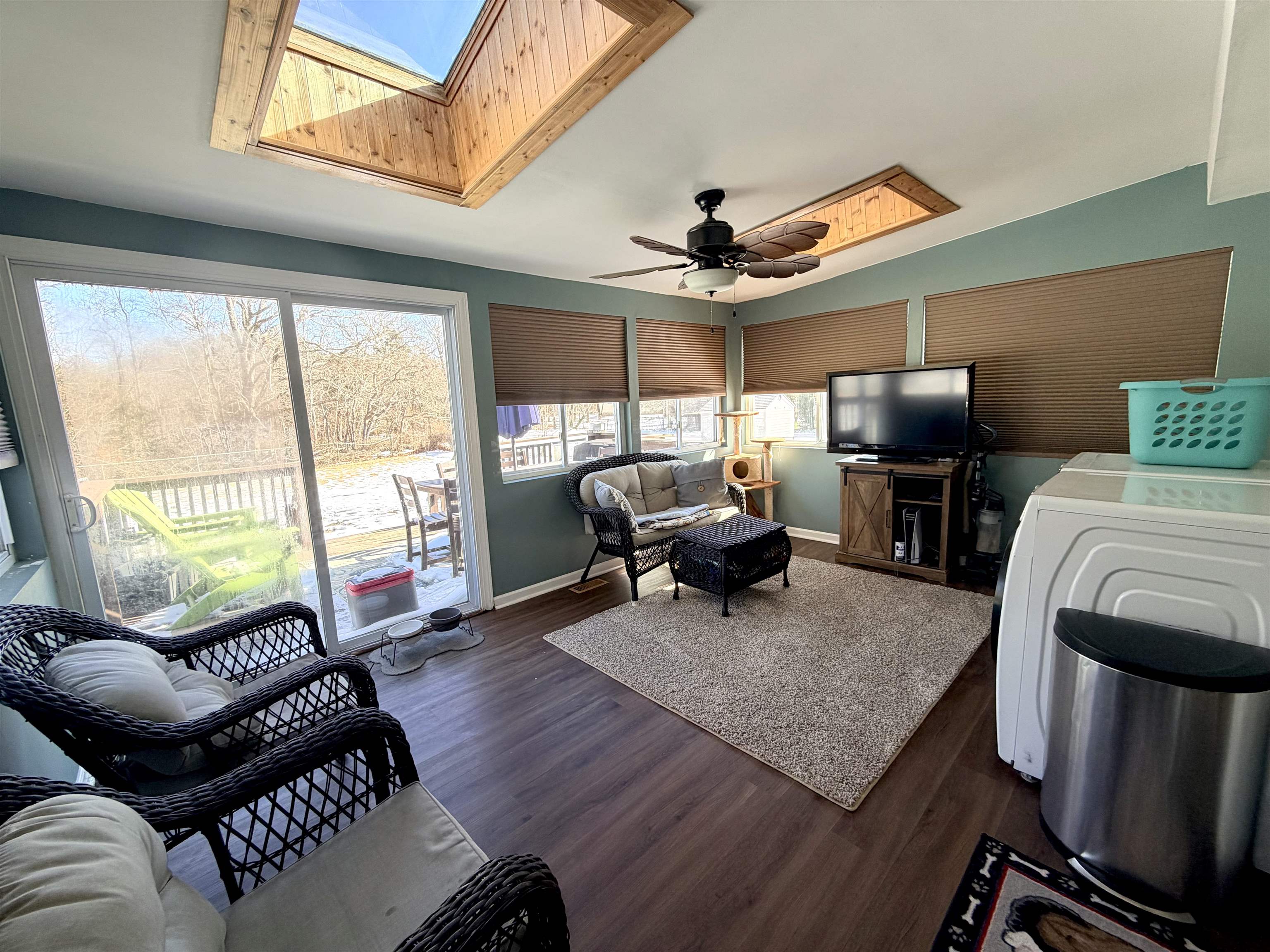 48 Siegtown Road Cape May Court House, NJ 08210 - Photo 17 of 21 a living room with furniture a fireplace and a floor to ceiling window