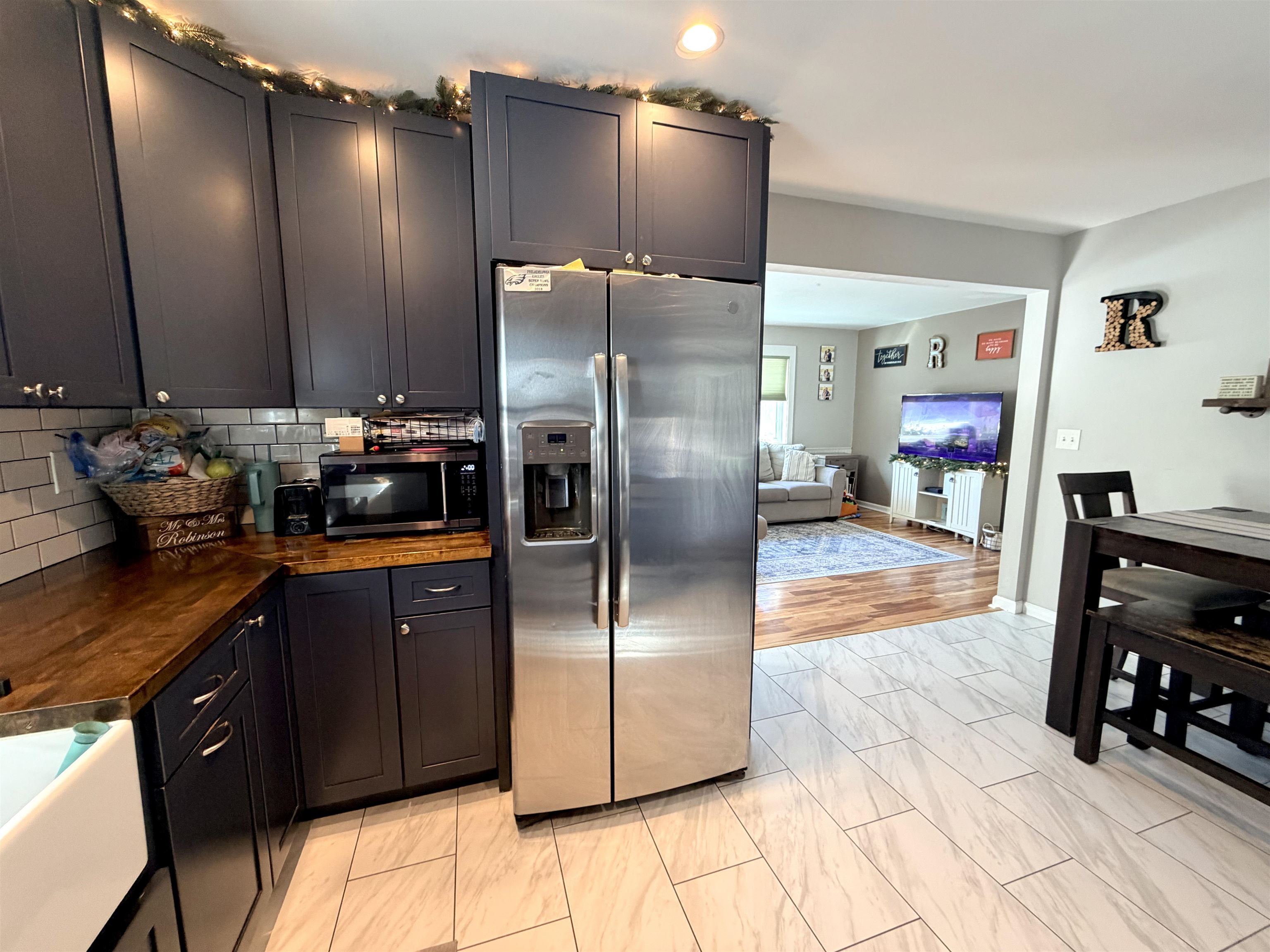 48 Siegtown Road Cape May Court House, NJ 08210 - Photo 18 of 21 a kitchen with stainless steel appliances granite countertop a refrigerator a sink and a stove with wooden floor