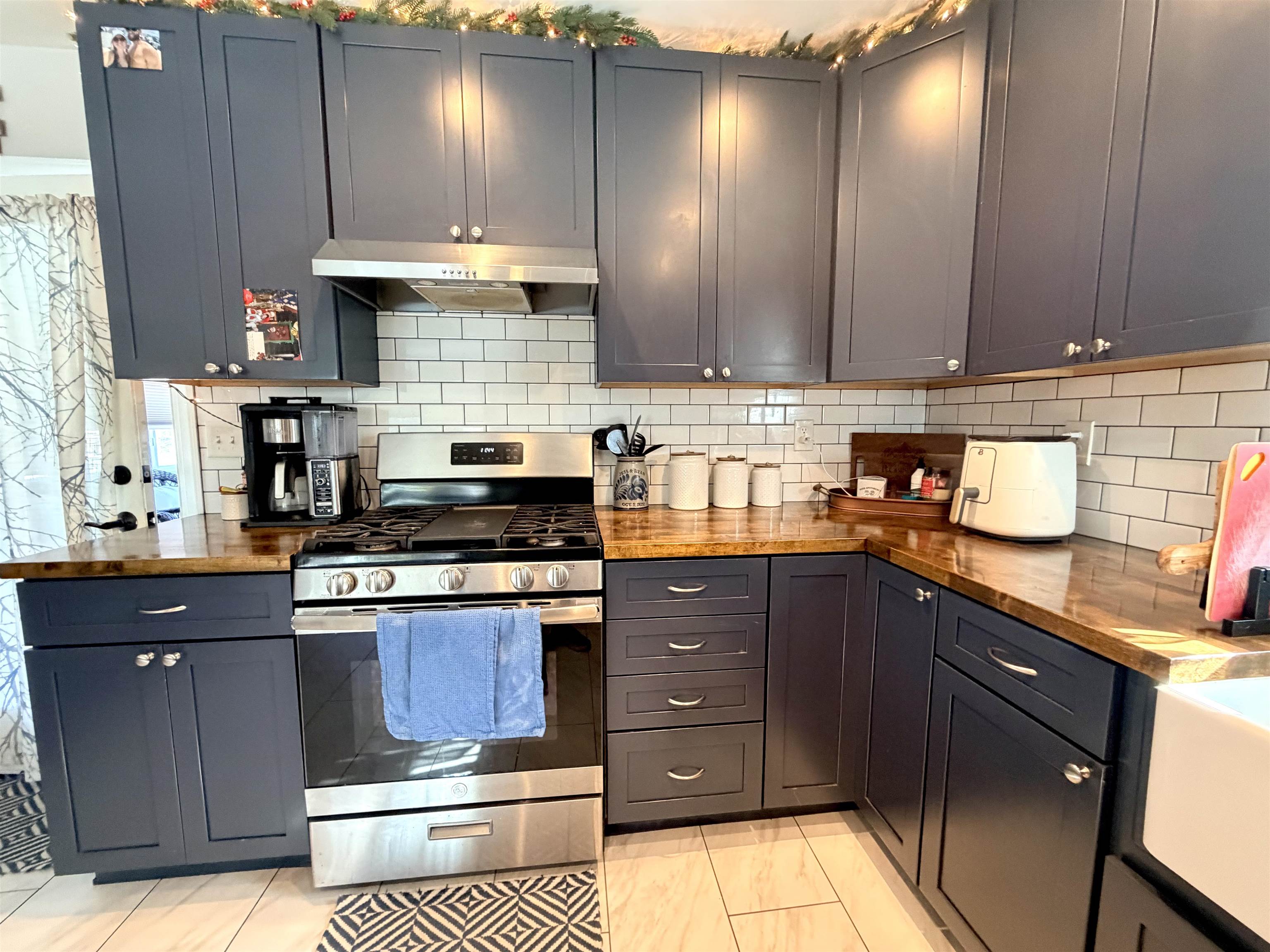 48 Siegtown Road Cape May Court House, NJ 08210 - Photo 6 of 21 a kitchen with stainless steel appliances granite countertop a stove a sink and a microwave