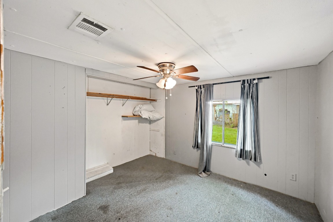 2137 Honey Tree Street Conroe, TX 77385 - Photo 10 of 13 an empty room with windows and closet