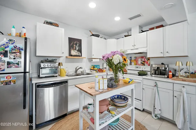 a bedroom with bed and a window