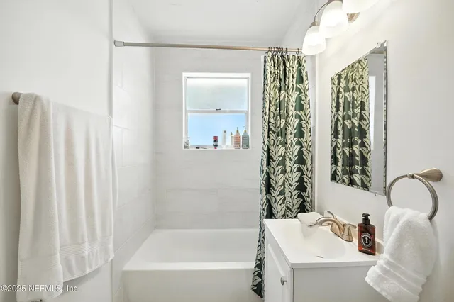 a view of a house with a yard and porch