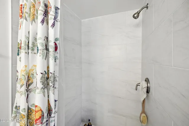 a kitchen with granite countertop a refrigerator and a sink