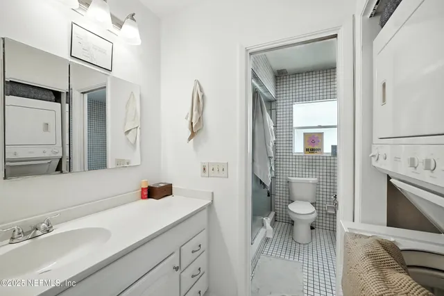 a view of a house with backyard sitting area and swimming pool