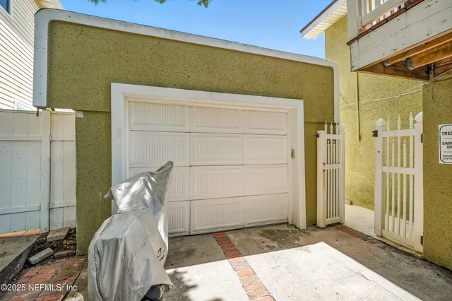 a kitchen with a wooden floor and a refrigerator