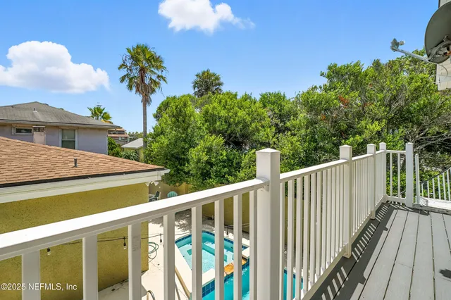 a kitchen with a refrigerator and a sink