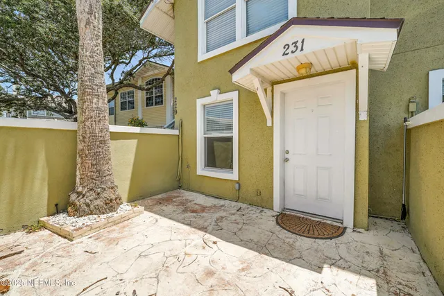 a view of a room with a ceiling fan