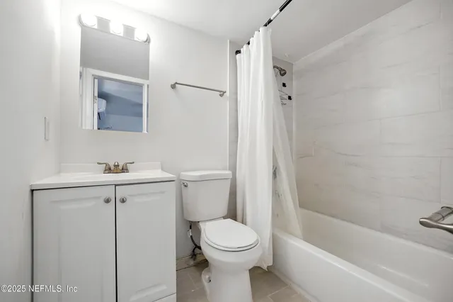 a view of cabinets a washer and dryer