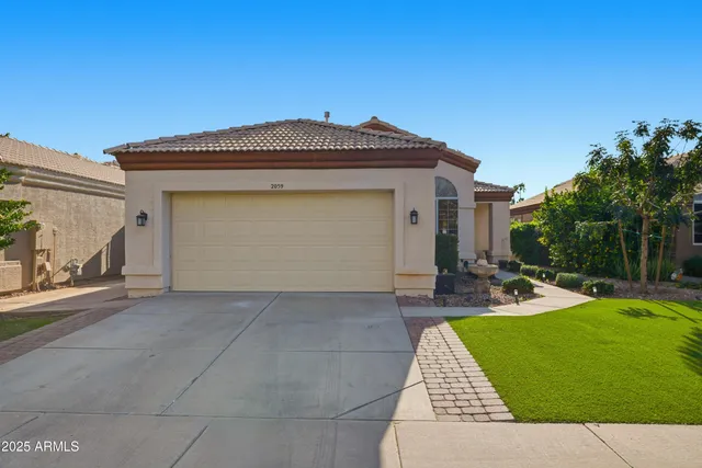 a front view of a house with yard