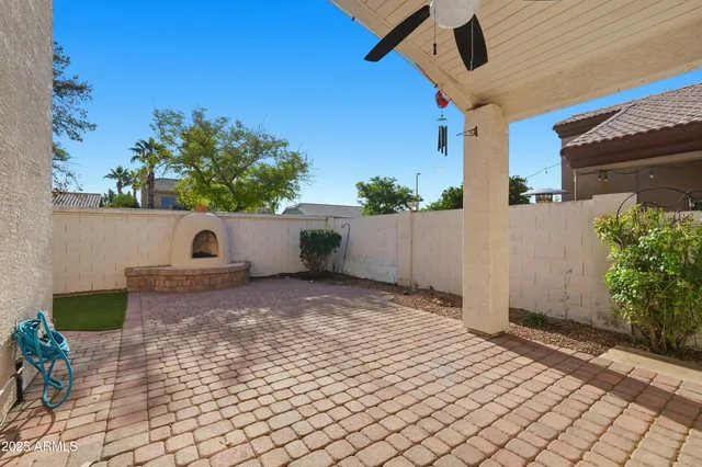 a view of a white house with a large window