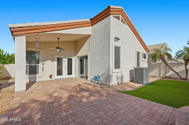 a backyard of a house with seating space