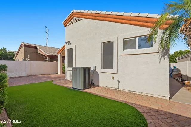 a view of a backyard with potted plants